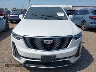 2023 Cadillac XT6 FWD Luxury z VIN 1GYKPAR4XPZ182533, wystawiony jako IAAI lot #42078937 z przebiegiem 31 248 mil mil oraz . Historia ofert i sprzedaży dostępna na DreamBid. Obrazek 6.
