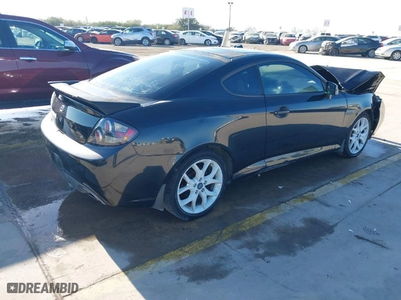 2007 Hyundai Tiburon GT with VIN KMHHN66F87U259322, listed as a IAAI auction lot 41204907 with 79,379 mi miles. Bid and sale history available at carsss.com. Image 4.