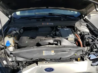 2015 Ford Fusion SE Hybrid z VIN 3FA6P0LU7FR102723, wystawiony jako Copart lot #62334345 z przebiegiem 136 341 mil mil oraz Nie do naprawy • Non repairable. Historia ofert i sprzedaży dostępna na DreamBid. Obrazek 11.