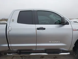 2012 Toyota Tundra z VIN 5TFRY5F18CX121917, wystawiony jako IAAI lot #41475681 z przebiegiem 166 507 mil mil oraz . Historia ofert i sprzedaży dostępna na DreamBid. Obrazek 13.