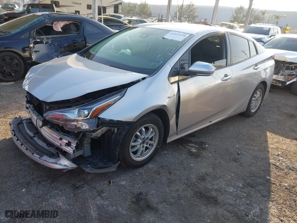 2019 Toyota Prius L Eco with VIN JTDKARFU2K3082593, listed as a IAAI auction lot 41657698 with 239,412 mi miles. Bid and sale history available at carsss.com. Image 2.