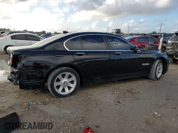 2011 BMW 7 Series 740i with VIN WBAKA4C59BC392351, listed as a Copart auction lot 84942304 with 76,874 mi miles and Salvage Title. Bid and sale history available at carsss.com. Image 3.