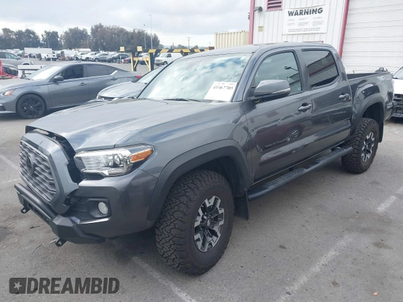 2021 Toyota Tacoma SR z VIN 3TMCZ5AN9MM397611, wystawiony jako IAAI lot #41467705 z przebiegiem 65 191 mil mil oraz . Historia ofert i sprzedaży dostępna na DreamBid. Obrazek 17.