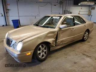 2002 Mercedes-Benz E-Class with VIN WDBJF65J12B485293, listed as a Copart auction lot 77561984 with 140,708 mi miles and Salvage Title. Bid and sale history available at carsss.com. Image 1.