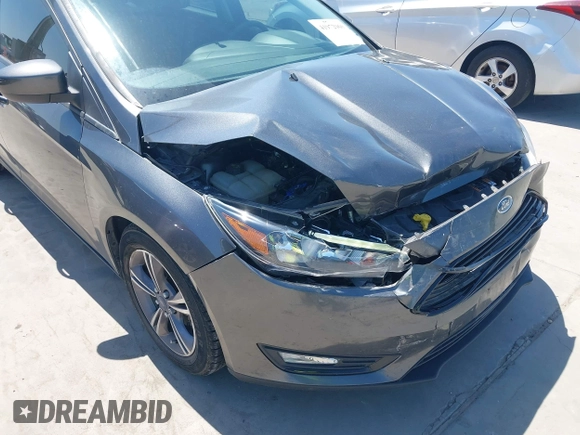 2018 Ford Focus SE with VIN 1FADP3FE3JL204220, listed as a IAAI auction lot 41972960 with 62,682 mi miles and . Bid and sale history available at DreamBid. Image 18.