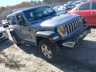 2018 Jeep Wrangler Unlimited Sport S with VIN 1C4HJXDNXJW324957, listed as a IAAI auction lot 40934979 with 130,338 mi miles and . Bid and sale history available at DreamBid. Image 1.