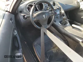 2007 Pontiac Solstice z VIN 1G2MB35B57Y141041, wystawiony jako Copart lot #70661994 z przebiegiem Nie podano mil oraz Czysty tytuł • Clean title. Historia ofert i sprzedaży dostępna na DreamBid. Obrazek 8.