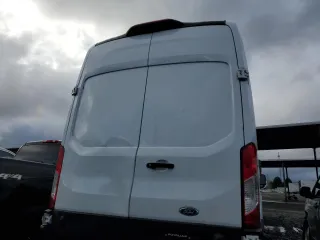 2023 Ford Transit Cargo z VIN 1FTBR1X8XPKB14862, wystawiony jako Copart lot #83661874 z przebiegiem Nie podano mil oraz Szkoda całkowita • Salvage title. Historia ofert i sprzedaży dostępna na DreamBid. Obrazek 6.
