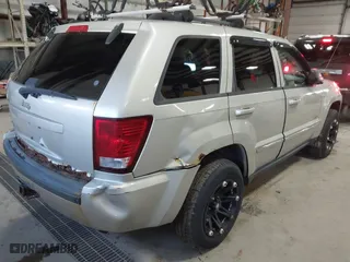 2010 Jeep Grand Cherokee Laredo with VIN 1J4PR4GK9AC160097, listed as a IAAI auction lot 41883264 with 240,409 mi miles. Bid and sale history available at carsss.com. Image 4.