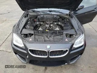 2014 BMW M6 z VIN WBSLZ9C50EDZ78599, wystawiony jako Copart lot #84724974 z przebiegiem 115 051 mil mil oraz Czysty tytuł • Clean title. Historia ofert i sprzedaży dostępna na DreamBid. Obrazek 11.