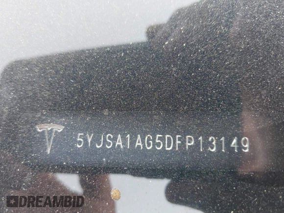 2013 Tesla Model S with VIN 5YJSA1AG5DFP13149, listed as a IAAI auction lot 42116437 with 140,999 mi miles. Bid and sale history available at carsss.com. Image 9.