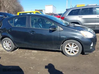2013 Toyota Prius c One with VIN JTDKDTB36D1034076, listed as a IAAI auction lot 41622385 with 148,920 mi miles. Bid and sale history available at carsss.com. Image 13.
