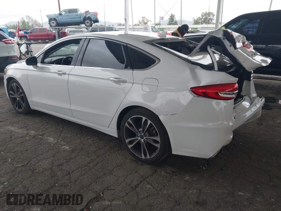 2019 Ford Fusion Titanium with VIN 3FA6P0K90KR236674, listed as a IAAI auction lot 42008633 with 99,737 mi miles and . Bid and sale history available at DreamBid. Image 3.