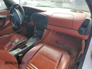 1999 Porsche Boxster z VIN WP0CA2984XU629987, wystawiony jako Copart lot #51366845 z przebiegiem Nie podano mil oraz Czysty tytuł • Clean title. Historia ofert i sprzedaży dostępna na DreamBid. Obrazek 8.