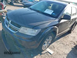 2017 Dodge Journey SE z VIN 3C4PDCAB9HT551840, wystawiony jako IAAI lot #41977338 z przebiegiem 202 856 mil mil oraz . Historia ofert i sprzedaży dostępna na DreamBid. Obrazek 17.