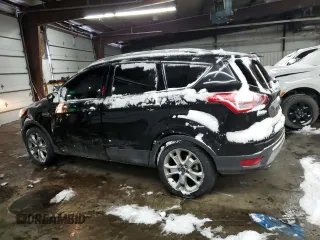 2015 Ford Escape Titanium with VIN 1FMCU0J91FUA41653, listed as a Copart auction lot 88871205 with 128,971 mi miles and Salvage Title. Bid and sale history available at DreamBid. Image 2.