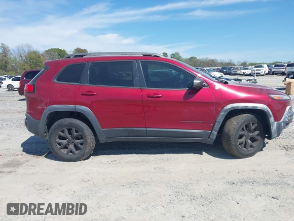 2015 Jeep Cherokee Trailhawk with VIN 1C4PJMBS1FW640483, listed as a IAAI auction lot 41883688 with 103,589 mi miles. Bid and sale history available at carsss.com. Image 13.