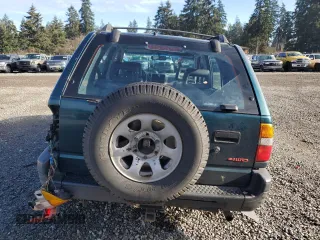 1999 Isuzu Rodeo S with VIN 4S2CM58W7X4359649, listed as a Copart auction lot 83450174 with 171,940 mi miles and Salvage title. Bid and sale history available at DreamBid. Image 6.