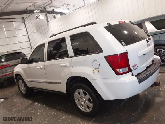 2010 Jeep Grand Cherokee Laredo with VIN 1J4PR4GK1AC143486, listed as a IAAI auction lot 41761763 with 159,139 mi miles. Bid and sale history available at carsss.com. Image 14.