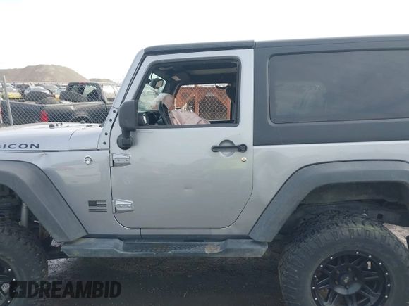 2013 Jeep Wrangler Rubicon 10th Anniversary with VIN 1C4BJWCG8DL639121, listed as a IAAI auction lot 40561773 with 56,023 mi miles and . Bid and sale history available at DreamBid. Image 14.