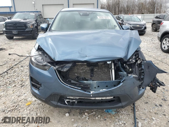 2016 Mazda CX-5 Grand Touring z VIN JM3KE4DY2G0637779, wystawiony jako Copart lot #52001805 z przebiegiem 184 381 mil mil oraz Czysty tytuł • Clean title. Historia ofert i sprzedaży dostępna na DreamBid. Obrazek 5.