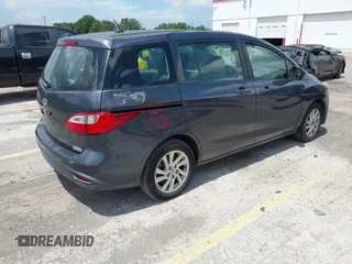 2012 Mazda 5 Sport with VIN JM1CW2BL8C0131745, listed as a IAAI auction lot 42625411 with 194,875 mi miles and . Bid and sale history available at DreamBid. Image 4.