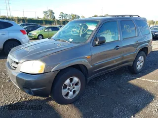 2003 Mazda Tribute LX with VIN 4F2CZ94133KM52401, listed as a IAAI auction lot 42142297 with Not Provided miles and . Bid and sale history available at carsss.com. Image 2.