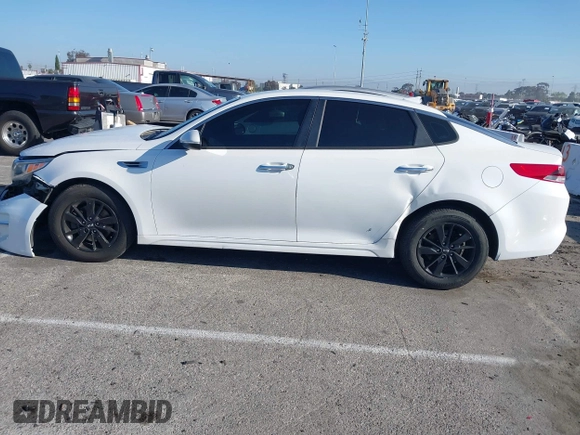 2016 Kia Optima LX with VIN 5XXGT4L33GG014082, listed as a IAAI auction lot 41870030 with 137,849 mi miles and . Bid and sale history available at DreamBid. Image 13.