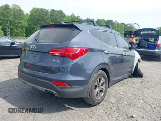 2016 Hyundai Santa Fe z VIN 5XYZU3LB4GG308030, wystawiony jako IAAI lot #42102832 z przebiegiem Nie podano mil oraz . Historia ofert i sprzedaży dostępna na DreamBid. Obrazek 4.