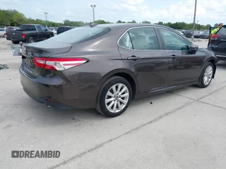 2019 Toyota Camry LE with VIN 4T1B11HKXKU818442, listed as a IAAI auction lot 41906128 with 30,728 mi miles and . Bid and sale history available at DreamBid. Image 4.