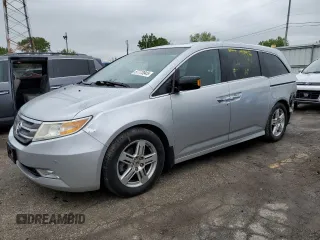 2012 Honda Odyssey Touring с VIN 5FNRL5H98CB052349, выставлен на аукционе Copart как лот 57773945 с пробегом 188 630 миль миль и Списание • Salvage title. История ставок и продаж доступна на DreamBid. Изображение 1.