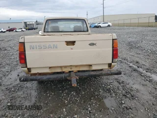1986 Nissan Hardbody E z VIN JN6ND11S7GW014787, wystawiony jako Copart lot #45291425 z przebiegiem 171 557 mil mil oraz Szkody całkowita. Historia ofert i sprzedaży dostępna na DreamBid. Obrazek 6.