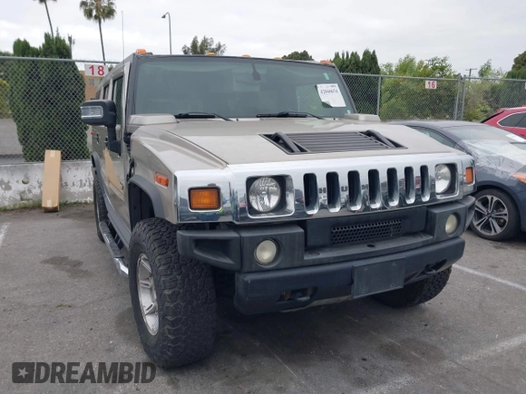 2005 Hummer H2 SUV with VIN 5GRGN23U95H129470, listed as a IAAI auction lot 42046654 with 63,489 mi miles. Bid and sale history available at carsss.com. Image 1.