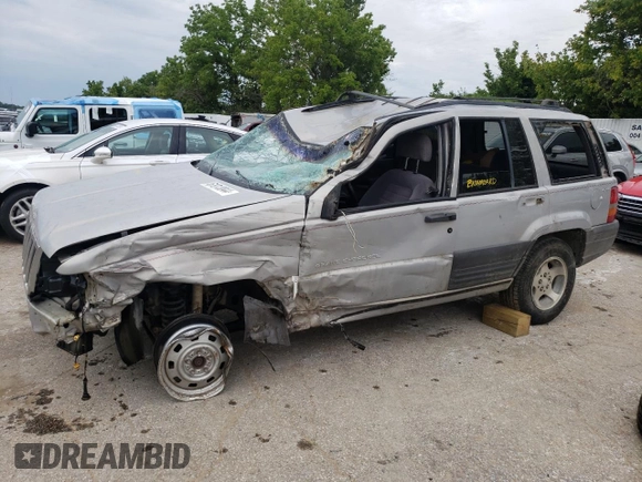 1996 Jeep Grand Cherokee Laredo with VIN 1J4GZ58S2TC401845, listed as a Copart auction lot 61013044 with 0 mi miles and Salvage Title. Bid and sale history available at carsss.com. Image 1.