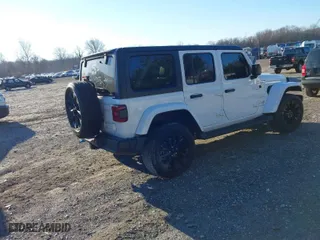 2023 Jeep Wrangler 4xe Sahara with VIN 1C4JJXP61PW684682, listed as a IAAI auction lot 40998281 with 41,138 mi miles. Bid and sale history available at carsss.com. Image 4.