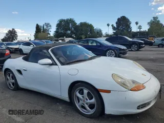 1999 Porsche Boxster z VIN WP0CA2984XU629987, wystawiony jako Copart lot #51366845 z przebiegiem Nie podano mil oraz Czysty tytuł • Clean title. Historia ofert i sprzedaży dostępna na DreamBid. Obrazek 4.