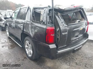 2015 Chevrolet Tahoe LTZ with VIN 1GNSCCKC7FR576236, listed as a IAAI auction lot 40794643 with 170,040 mi miles. Bid and sale history available at carsss.com. Image 3.