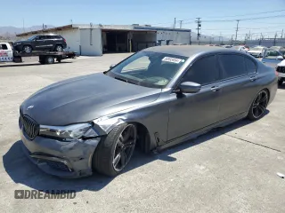 2018 BMW 7 Series 740i with VIN WBA7E2C59JG742809, listed as a Copart auction lot 66995934 with 62,017 mi miles and Salvage Title. Bid and sale history available at carsss.com. Image 1.