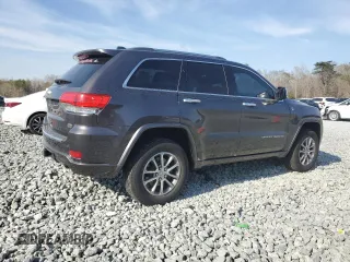 2015 Jeep Grand Cherokee Overland with VIN 1C4RJFCMXFC237723, listed as a Copart auction lot 50318145 with 103,741 mi miles and Salvage title. Bid and sale history available at DreamBid. Image 3.