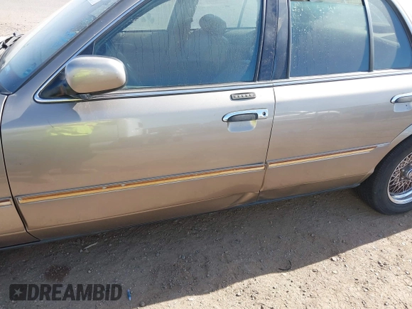 2002 Mercury Grand Marquis LS Premium z VIN 2MEFM75W32X636872, wystawiony jako IAAI lot #41717410 z przebiegiem 88 840 mil mil oraz . Historia ofert i sprzedaży dostępna na DreamBid. Obrazek 6.