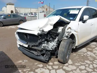2020 Mazda CX-5 Touring with VIN JM3KFACM9L0771919, listed as a IAAI auction lot 41527773 with 93,417 mi miles and . Bid and sale history available at DreamBid. Image 6.