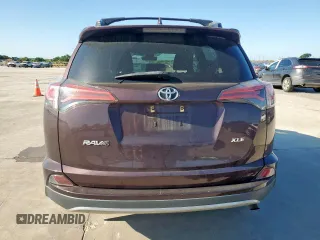 2018 Toyota RAV4 XLE with VIN 2T3WFREVXJW457073, listed as a Copart auction lot 62339635 with 75,321 mi miles and Salvage title. Bid and sale history available at DreamBid. Image 6.