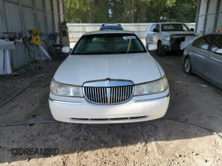 1999 Lincoln Town Car Executive with VIN 1LNHM81W2XY658371, listed as a Copart auction lot 60249045 with 191,266 mi miles and Salvage title. Bid and sale history available at DreamBid. Image 5.