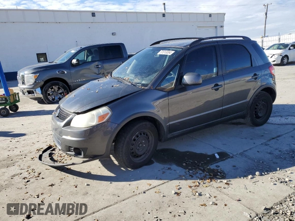 2010 Suzuki SX4 z VIN JS2YA5A35A6301406, wystawiony jako Copart lot #81810084 z przebiegiem 134 349 mil mil oraz Szkody całkowita. Historia ofert i sprzedaży dostępna na DreamBid. Obrazek 1.