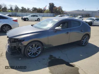 2019 Mazda Mazda3 Hatchback w/Preferred Pkg with VIN JM1BPBMM2K1133482, listed as a Copart auction lot 50001155 with 71,132 mi miles and Salvage Title. Bid and sale history available at carsss.com. Image 1.