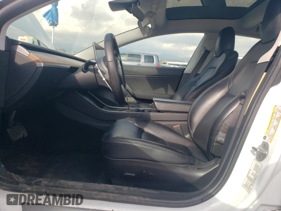2019 Tesla Model 3 Mid Range with VIN 5YJ3E1EA5KF485116, listed as a Copart auction lot 49289295 with 39,911 mi miles and Salvage Title. Bid and sale history available at DreamBid. Image 7.