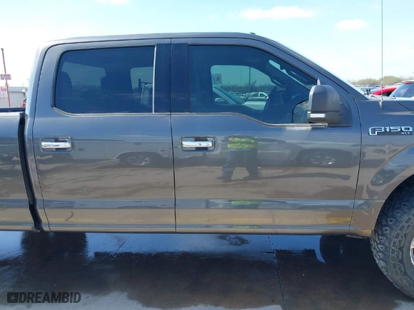 2015 Ford F-150 XLT w/HD Payload Pkg with VIN 1FTFW1EF7FKD04869, listed as a IAAI auction lot 41664736 with 165,784 mi miles. Bid and sale history available at carsss.com. Image 13.