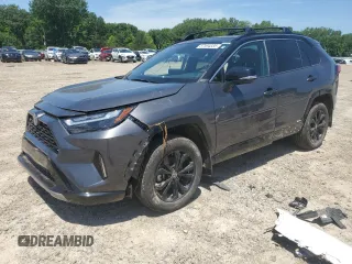 2023 Toyota RAV4 Hybrid XSE with VIN 2T3E6RFV9PW039963, listed as a Copart auction lot 57594335 with 27,486 mi miles and Salvage title. Bid and sale history available at DreamBid. Image 1.