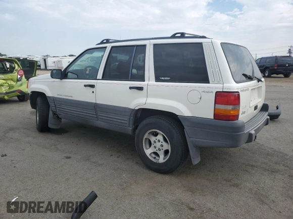 1997 Jeep Grand Cherokee Laredo with VIN 1J4GZ58S2VC676652, listed as a Copart auction lot 64939974 with 256,923 mi miles and Salvage Title. Bid and sale history available at carsss.com. Image 2.