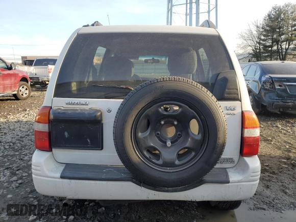 2000 Suzuki Grand Vitara JLX z VIN JS3TD62V4Y4121259, wystawiony jako Copart lot #43538045 z przebiegiem 127 915 mil mil oraz Szkoda całkowita • Salvage title. Historia ofert i sprzedaży dostępna na DreamBid. Obrazek 6.